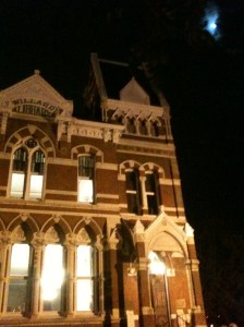 The moon hangs silent in the night sky as we arrive at Willard Library.